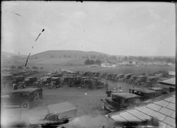 Large number of cars parked in a field, about 1915