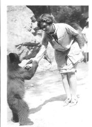 Bunni Cornelia E. Myers with bear cub, about 1925