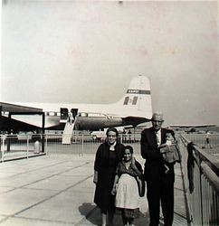 Bess and Oscar Hallberg at the airport in Mexico with their daughter in law Zenaida and one of the grandchildren, about 1960