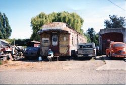 Old P&SR railroad car waiting for restoration on Bloomfield Road in Sebastopol, about 1975