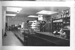 J. F. Triggs behind the counter at J. F. Triggs & Son Auto parts store at 130 South Main Street Sebastopol, 1939