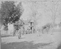 A. J. Peterson family playing croquet in front of their house in Santa Rosa