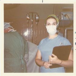 Nancy Sanchetti, Palm Drive Hospital nurse in surgery clothes and holding a clipboard