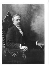 Portrait photo of Luther Burbank, about 1900 seated in ornate chair