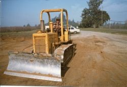 Ground being prepared for construction of the Hallberg Apple Farm fruit stand and bakery, about 1982