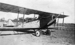 Biplane at Cnopius Field (Sebastopol Airport) with August S. Huck, Sr. in back