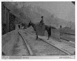 Mrs. Vanderleith on horseback on ramp at Charles E. Fuller's Mill, Occidental 1898