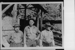 John W. Gonnella, Ralph S. Sturgeon and Wade Sturgeon in front of the boiler at Sturgeon's Mill in Occidental, California, 1931