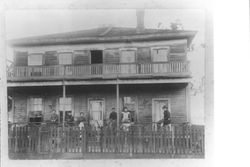 Witham family on porch of their home