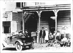 Group on steps of real estate office and Altamont Hotel in Occidental, California, March 8, 1914