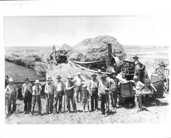 Steam powered thrashing machine and crew