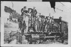 Men standing on locomotive
