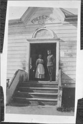 Louise Witham and Joe Williamson in doorway of Freestone School