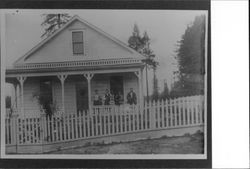 Four people on the porch of the Bittner home