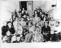 High school students sitting on school steps