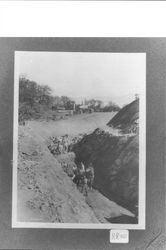 Men and equipment making a cut for the right of way of the Northwestern Pacific Railroad, Ukiah, California, 1897?