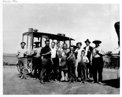 People eating ice cream cones in front of a vehicle used for selling ice cream