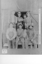 Seven men and a dog at apple dryer, Sebastopol, California, about 1900