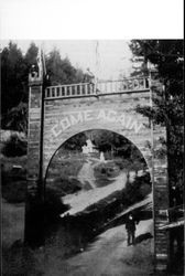 M.C. Meeker standing beneath arch