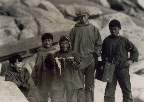 Boys on the rocky shore