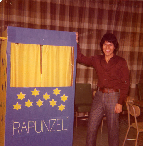 Tom Martinez with a Rapunzel puppet booth, East Los Angeles, California