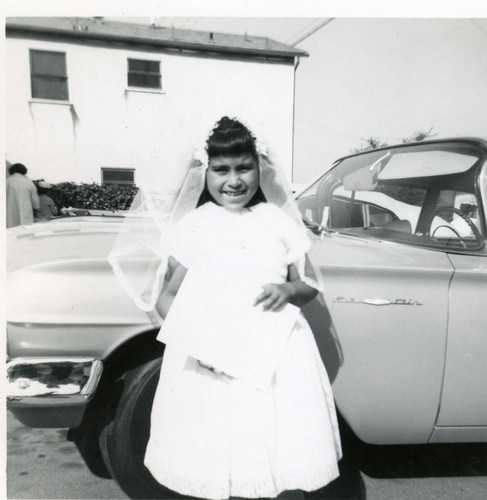 Susan Martinez dressed for the sacrament of First Communion