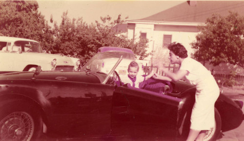 Infant in MG sports car and Martha Garcia