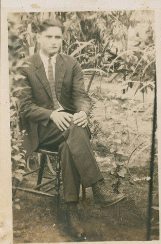 Jesus Pacheco sitting outside, Los Angeles, California