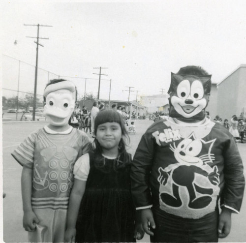 Martinez siblings at a Halloween parade