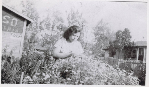 Expectant mother Lupe Salazar in the garden, East Los Angeles, California