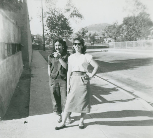 Ernestina Martinez and sister-in-law in front of Hammel Street Elementary School