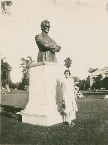 Monica Hernandez in front of the Lincoln the Lawyer statue in Lincoln Park, Los Angeles