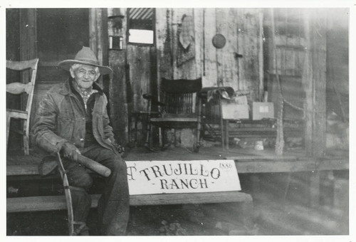 Dolores Trujillo sitting on the footsteps of the old house in Topanga, California