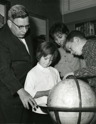 Paul Scott, Barry Shemaria and two children at the Lancaster Library, Lancaster, California