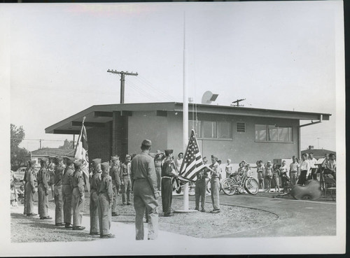 Boy Scouts raising the flag at the 1956 Sorensen Library dedication, Whittier