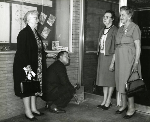 Removal of the 1950 Lancaster Library plaque from the Fig Avenue library location, Lancaster, California