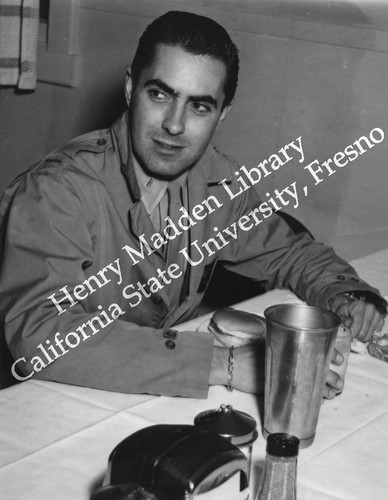 Man eating a meal in uniform