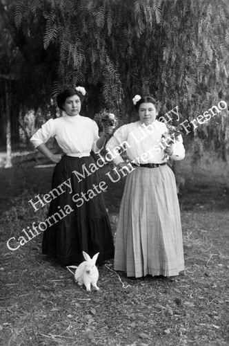 Two women with pet rabbit