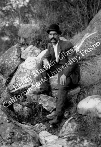 Man sitting on granite #1