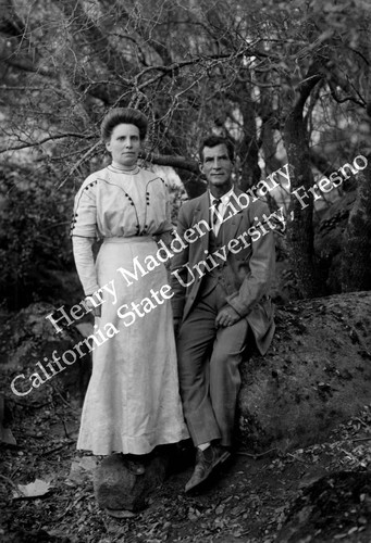 Man and woman posing for photo