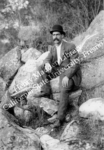 Man sitting on granite #2