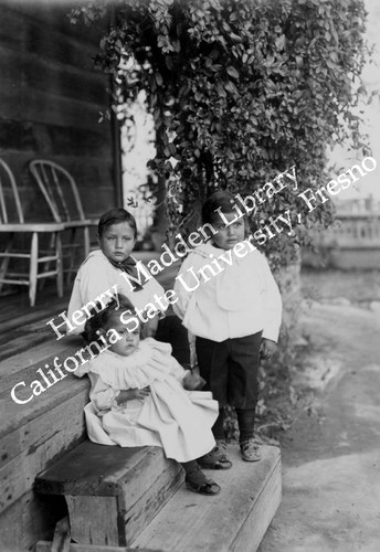 Three children on the steps