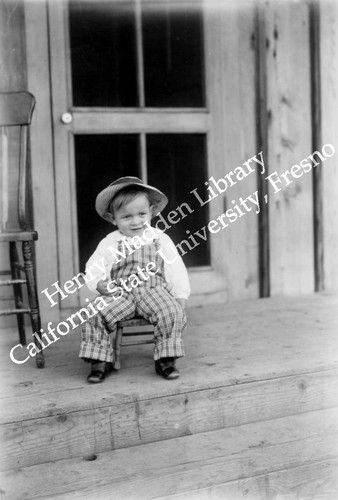 Child sitting on porch