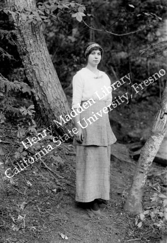 Woman standing in forest