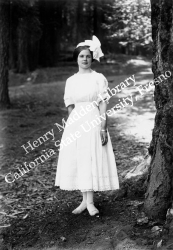 Young woman with large white bow