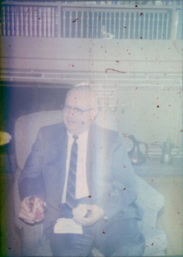 Unidentified man seated in a chair