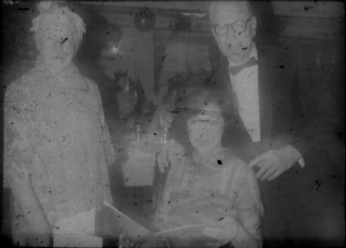 Unidentified man and two women wearing party attire aboard the M/S Stella Polaris