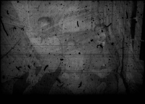 Two unidentified young men and an infant (Peters relatives?) sitting on a couch