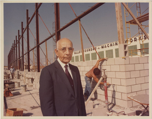 Leon Peters standing near new Valley Foundry construction