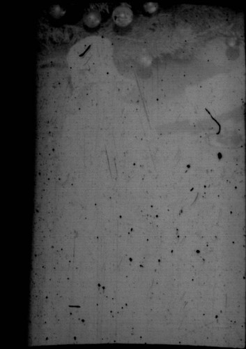 Unidentified child (Peters relative?) sitting in front of a Christmas tree